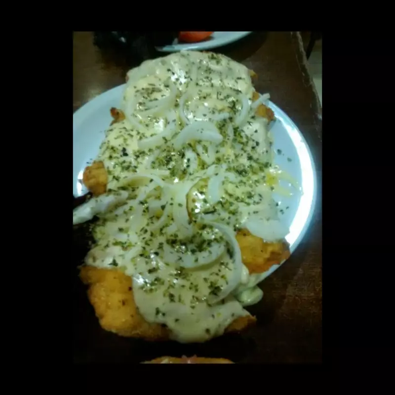 Milanesa o suprema  ala fugazzeta