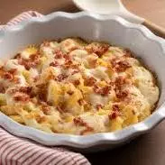 Nhoque ao molho de presunto e queijo