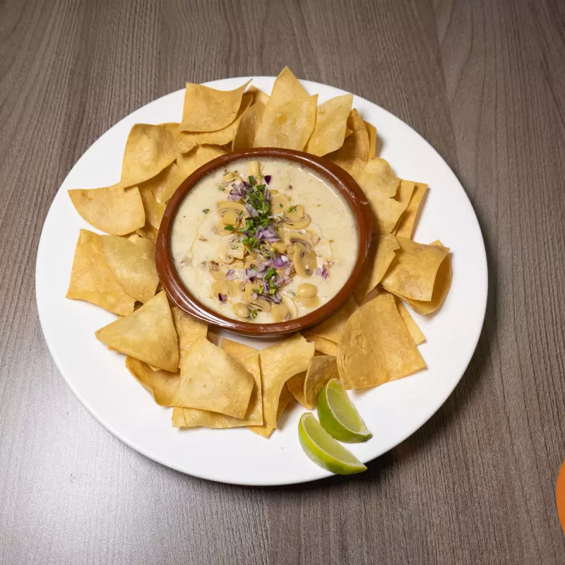 Queso fundido con champiñones
