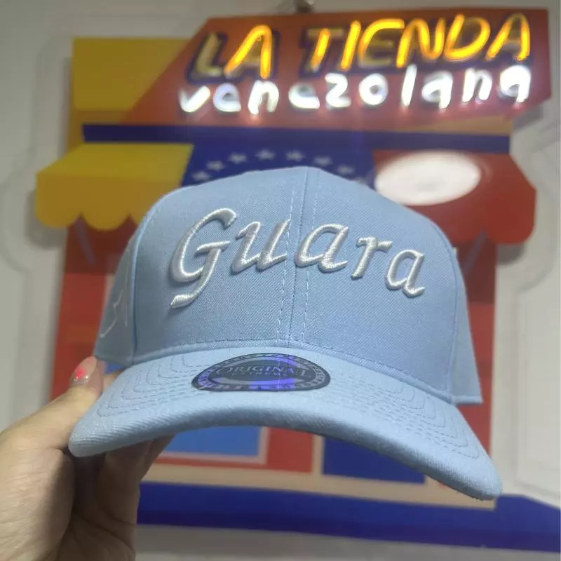 Gorra Guara celeste letra blanca