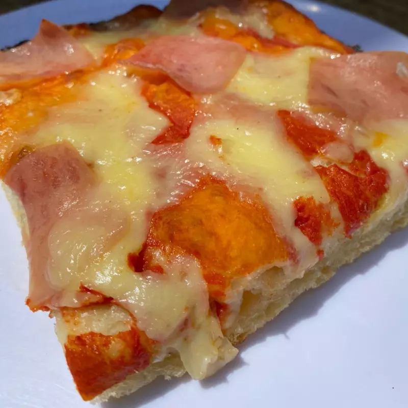 Porción Pizza Jamon y queso