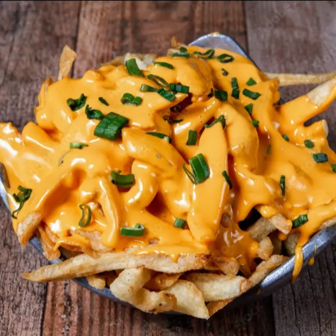 Fritas con cheddar y verdeo