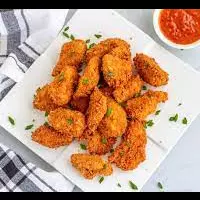 nuggets de pollo + 1 lata de quilmes