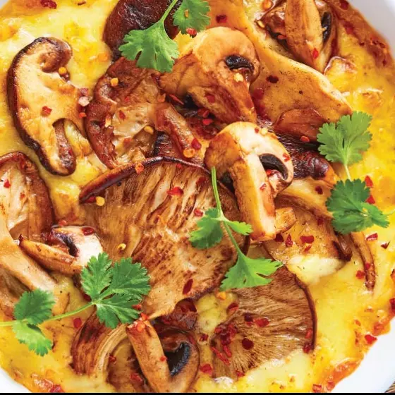 Queso fundido con champiñónes