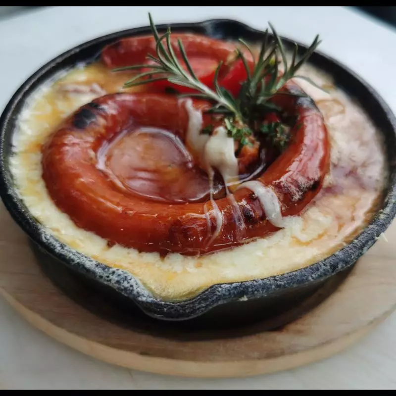 Queso fundido, flameado al Tequila